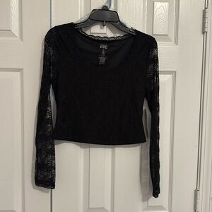 Black lace top, sheer sleeves. Crop.